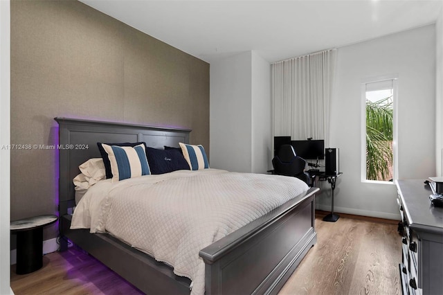 bedroom featuring hardwood / wood-style flooring