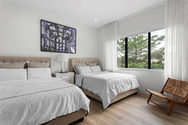 bedroom with light hardwood / wood-style floors