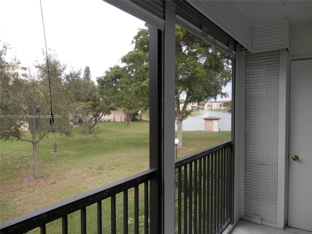 balcony featuring a water view