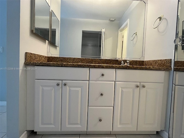 bathroom with vanity and tile patterned floors