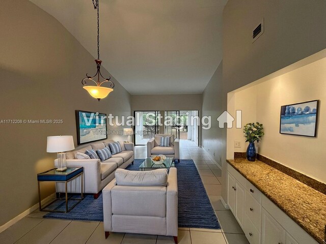 unfurnished room featuring light tile patterned floors