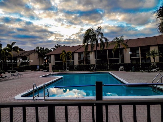 view of swimming pool with a patio area