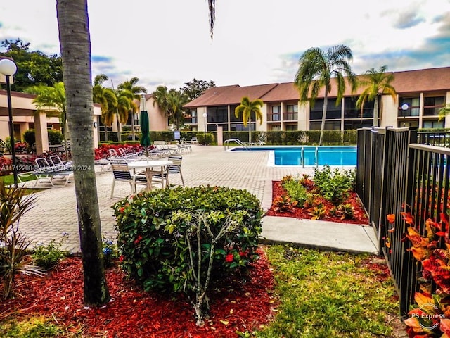 view of swimming pool with a patio area