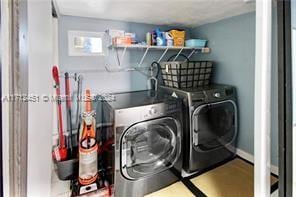 laundry room with separate washer and dryer