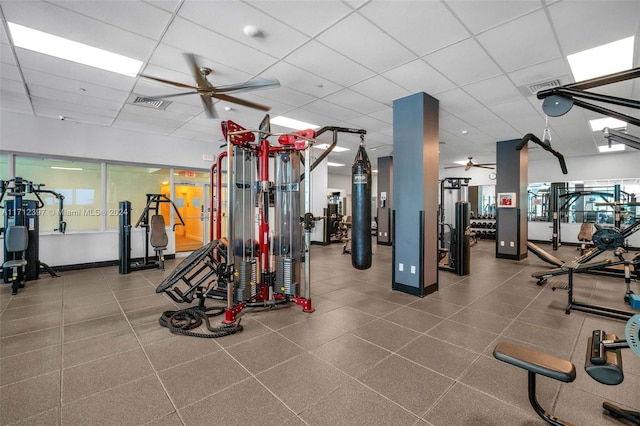 gym featuring a paneled ceiling and ceiling fan