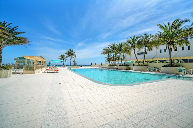 view of swimming pool featuring a patio area