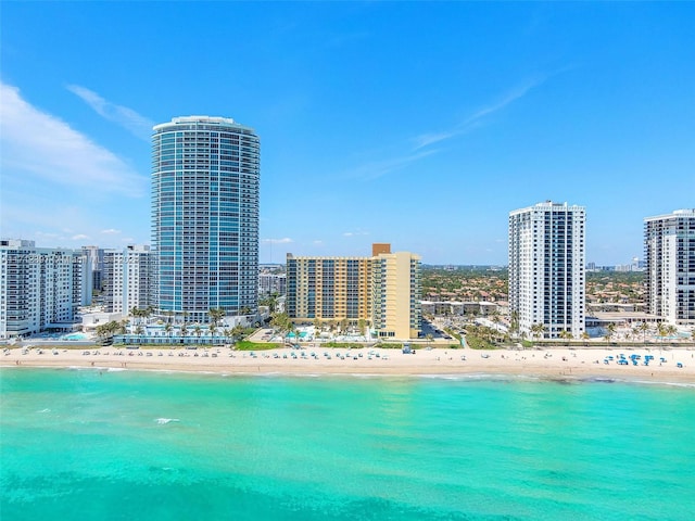 bird's eye view featuring a view of the beach and a water view