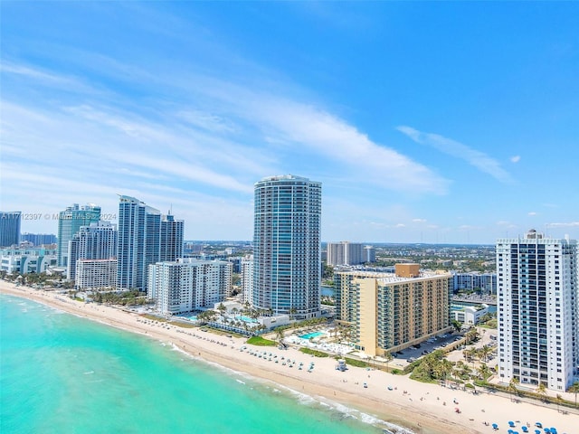 aerial view featuring a view of the beach and a water view