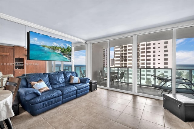 tiled living room featuring expansive windows and crown molding