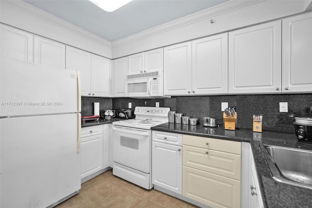 kitchen with white cabinets, white appliances, backsplash, and light tile patterned floors