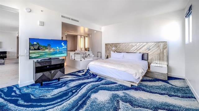 bedroom featuring hardwood / wood-style flooring