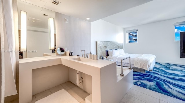 tiled bedroom featuring sink