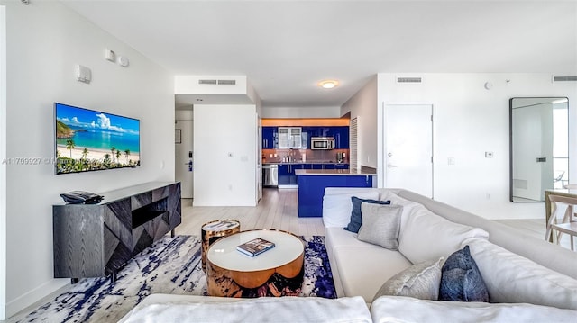 living room with light hardwood / wood-style floors