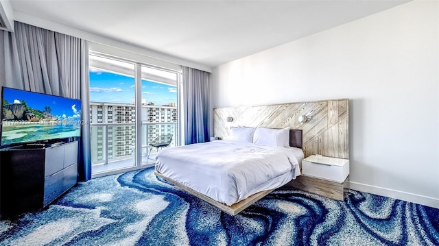 bedroom featuring carpet flooring and access to exterior