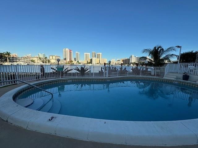450 Golden Isles Dr Unit 1C, Hallandale Beach, FL 33009 - community pool with a skyline view