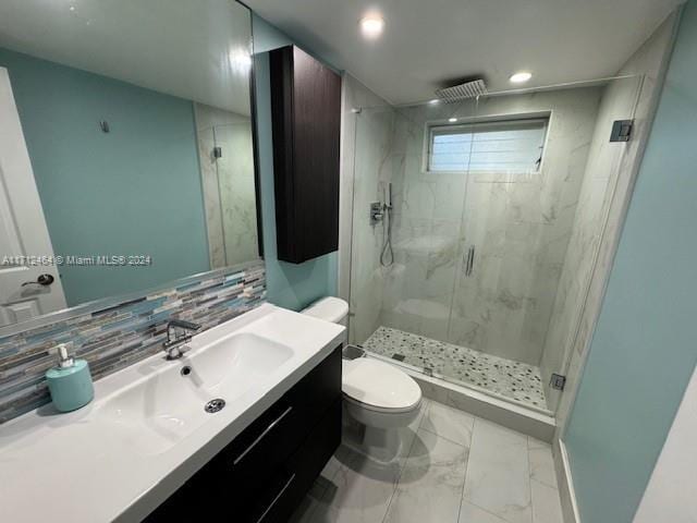 450 Golden Isles Dr Unit 1C, Hallandale Beach, FL 33009 - bathroom with marble finish flooring, a marble finish shower, vanity, decorative backsplash, and recessed lighting