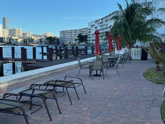 450 Golden Isles Dr Unit 1C, Hallandale Beach, FL 33009 - view of patio / terrace featuring a view of city
