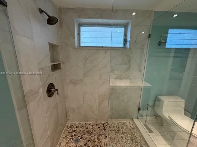 450 Golden Isles Dr Unit 1C, Hallandale Beach, FL 33009 - bathroom with a stall shower and recessed lighting