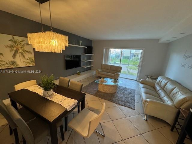 450 Golden Isles Dr Unit 1C, Hallandale Beach, FL 33009 - dining room with light tile patterned flooring