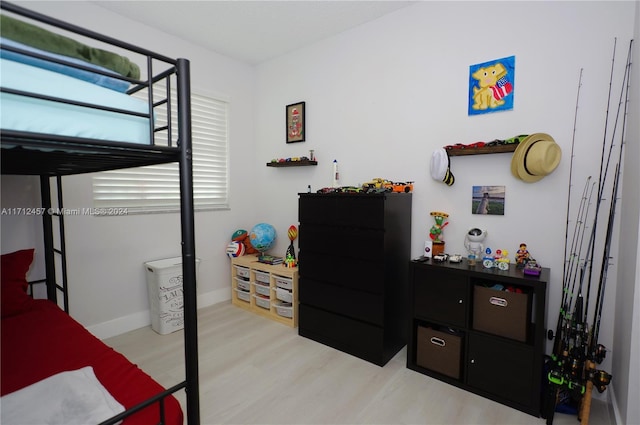 bedroom with light wood-type flooring