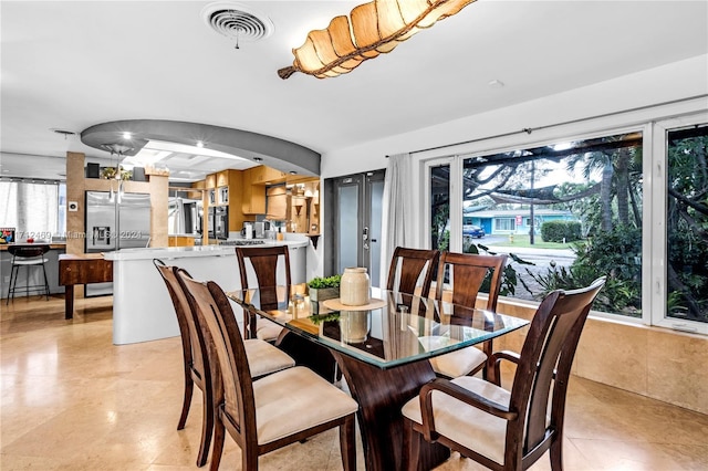 dining space with a wealth of natural light