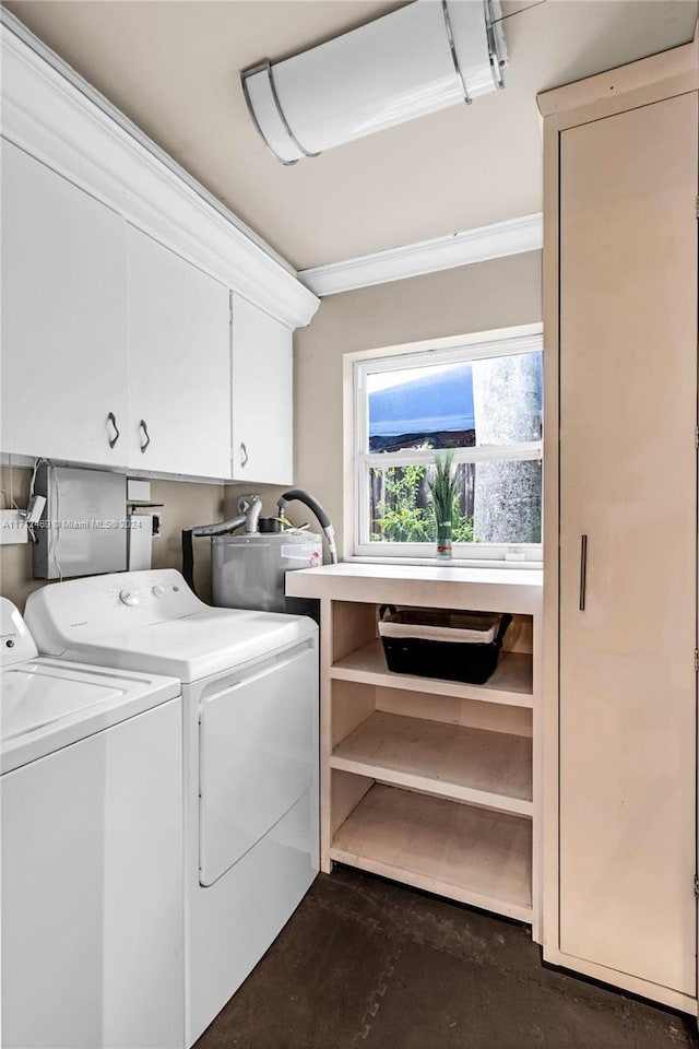 washroom with cabinets, separate washer and dryer, and crown molding