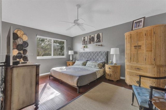 bedroom with ceiling fan and dark hardwood / wood-style flooring