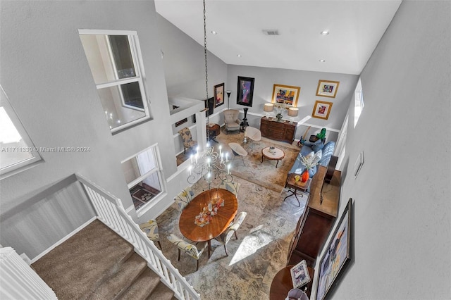 living room with high vaulted ceiling