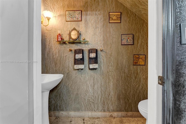 bathroom featuring toilet