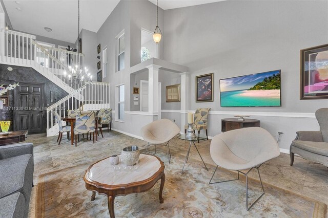 living room with high vaulted ceiling