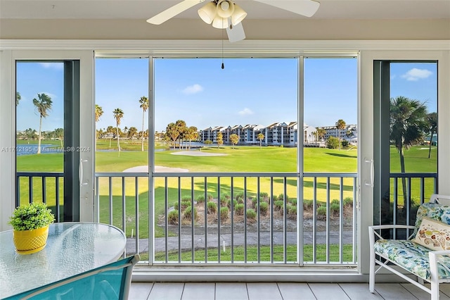 sunroom featuring a wealth of natural light and ceiling fan