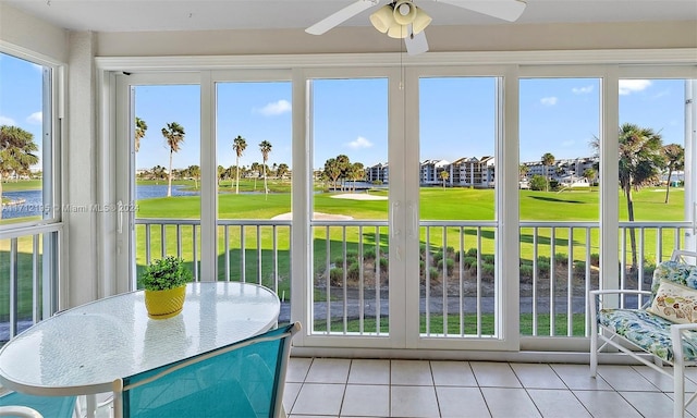 sunroom with plenty of natural light and ceiling fan