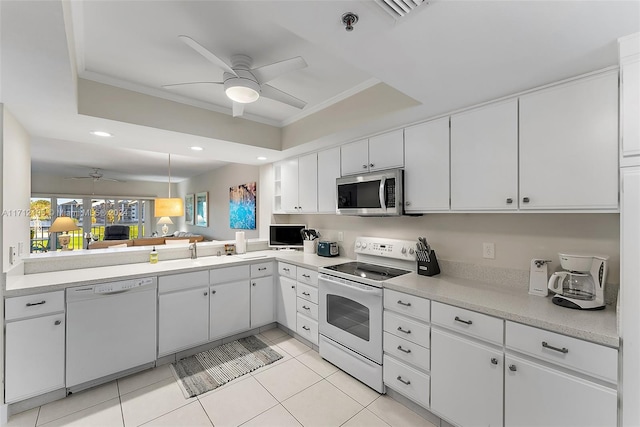 kitchen with white cabinetry, ceiling fan, white appliances, and ornamental molding