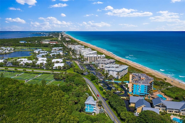 birds eye view of property featuring a view of the beach and a water view