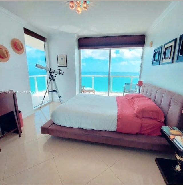 tiled bedroom with access to outside, multiple windows, a water view, and ornamental molding