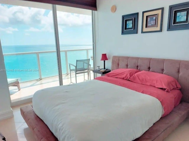 tiled bedroom featuring a water view