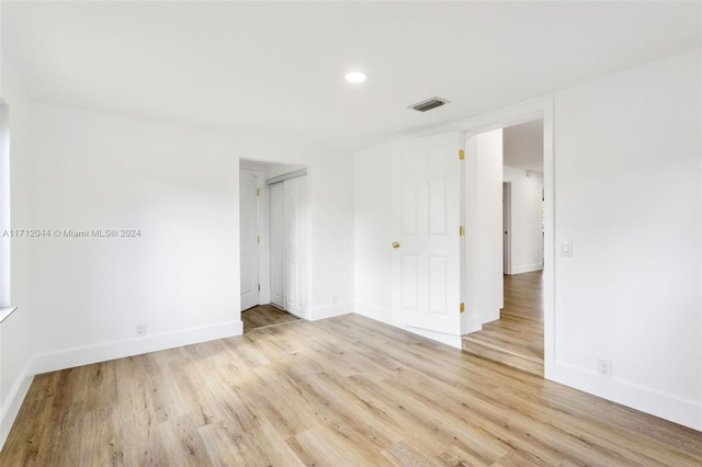 unfurnished room featuring light hardwood / wood-style floors