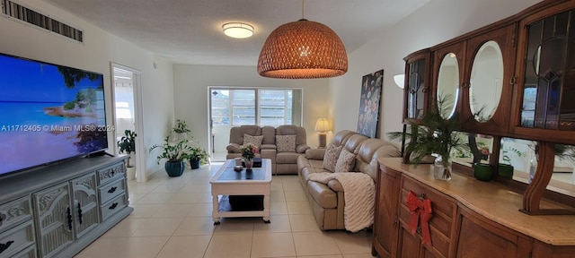 tiled living room with a textured ceiling