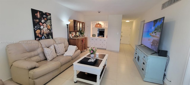 living room with light tile patterned floors