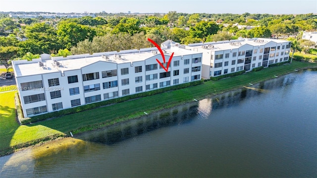 birds eye view of property with a water view