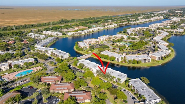 birds eye view of property featuring a water view