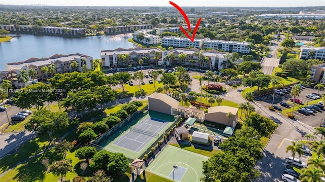 birds eye view of property featuring a water view