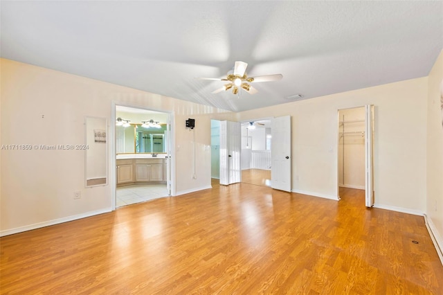 interior space featuring ceiling fan and light wood-type flooring