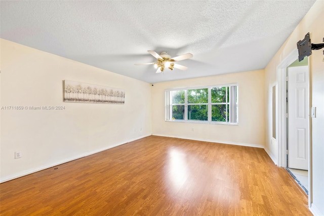 unfurnished bedroom featuring ceiling fan, light hardwood / wood-style flooring, and a textured ceiling