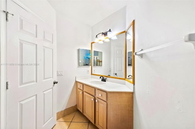 bathroom with tile patterned flooring and vanity