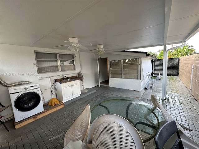 view of patio / terrace featuring ceiling fan and sink