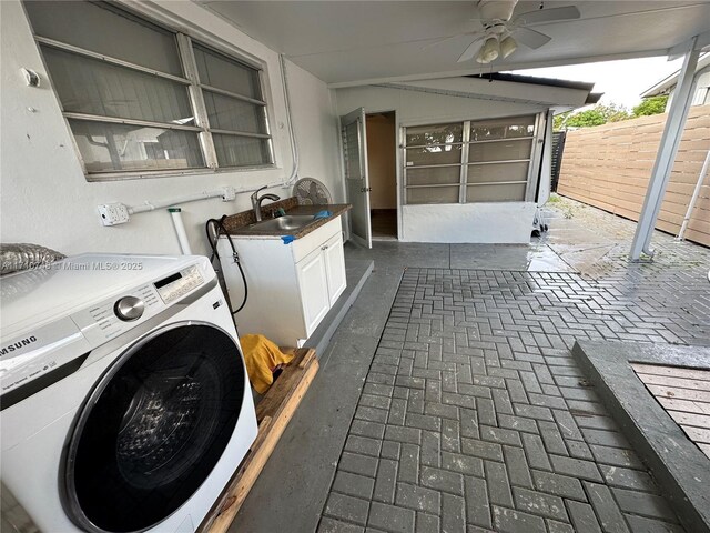 exterior space with ceiling fan, washer / dryer, and sink