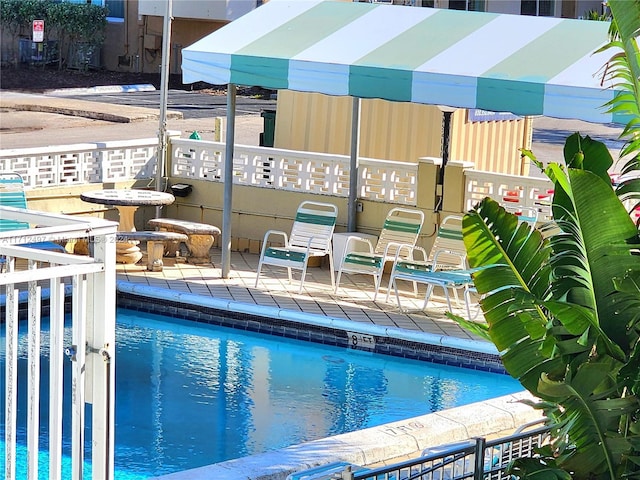 view of swimming pool with a patio area