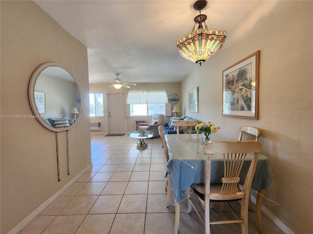 1504 S Surf Rd Unit 57, Hollywood, FL 33019 - dining area with light tile patterned flooring, ceiling fan, baseboards, and an AC wall unit