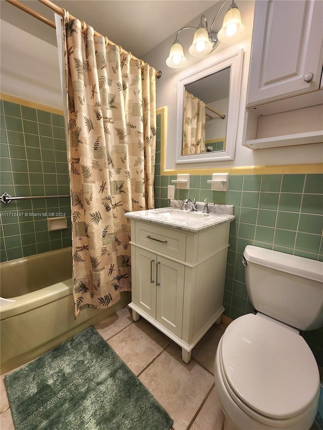 full bathroom with shower / bath combination with curtain, tile patterned floors, vanity, tile walls, and toilet